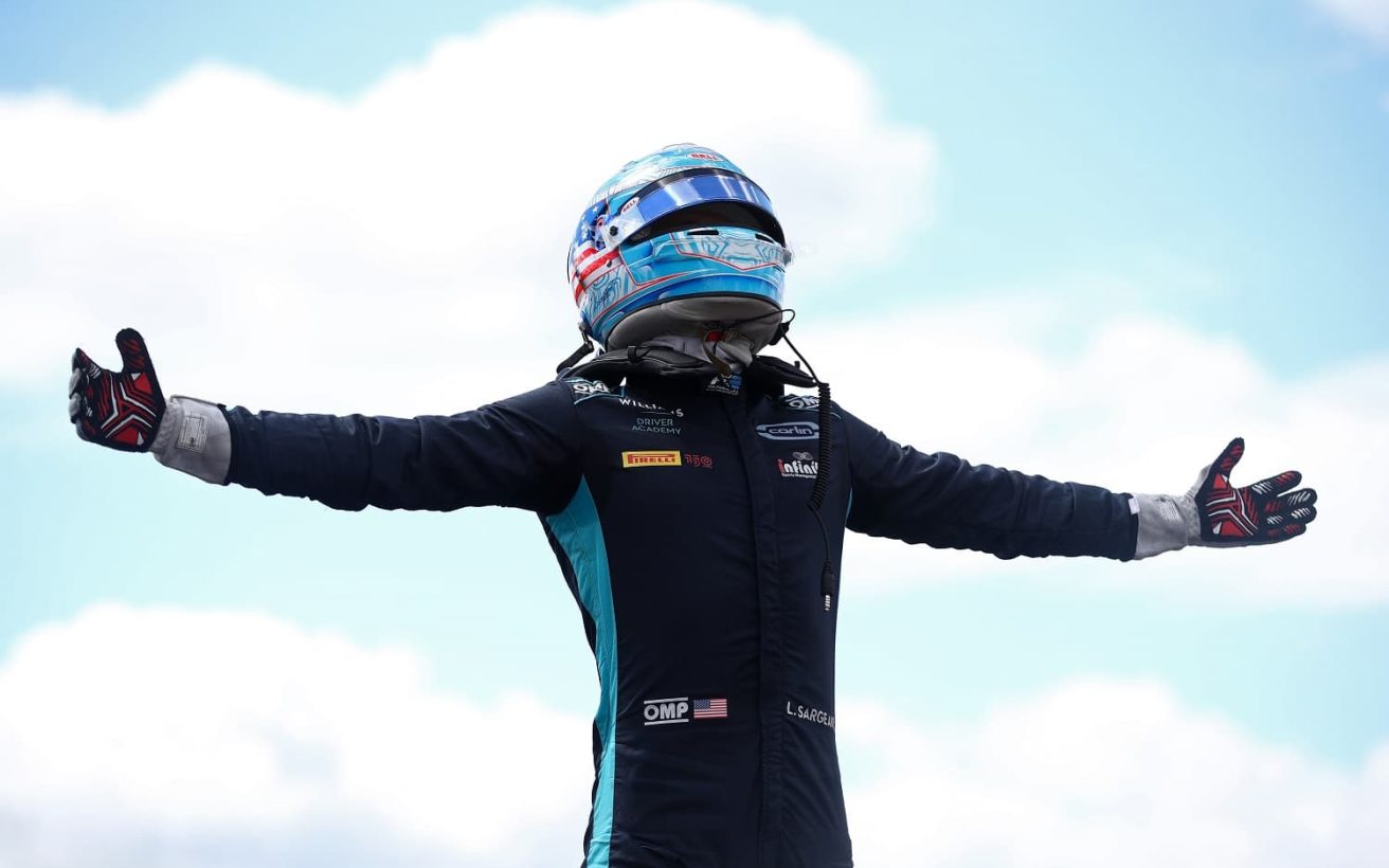 NORTHAMPTON, ENGLAND - JULY 03: Race winner Logan Sargeant of United States and Carlin (6) celebrates in parc ferme during the Round 7:Silverstone Feature race of the Formula 2 Championship at Silverstone on July 03, 2022 in Northampton, England. (Photo by Joe Portlock - Formula 1/Formula Motorsport Limited via Getty Images)