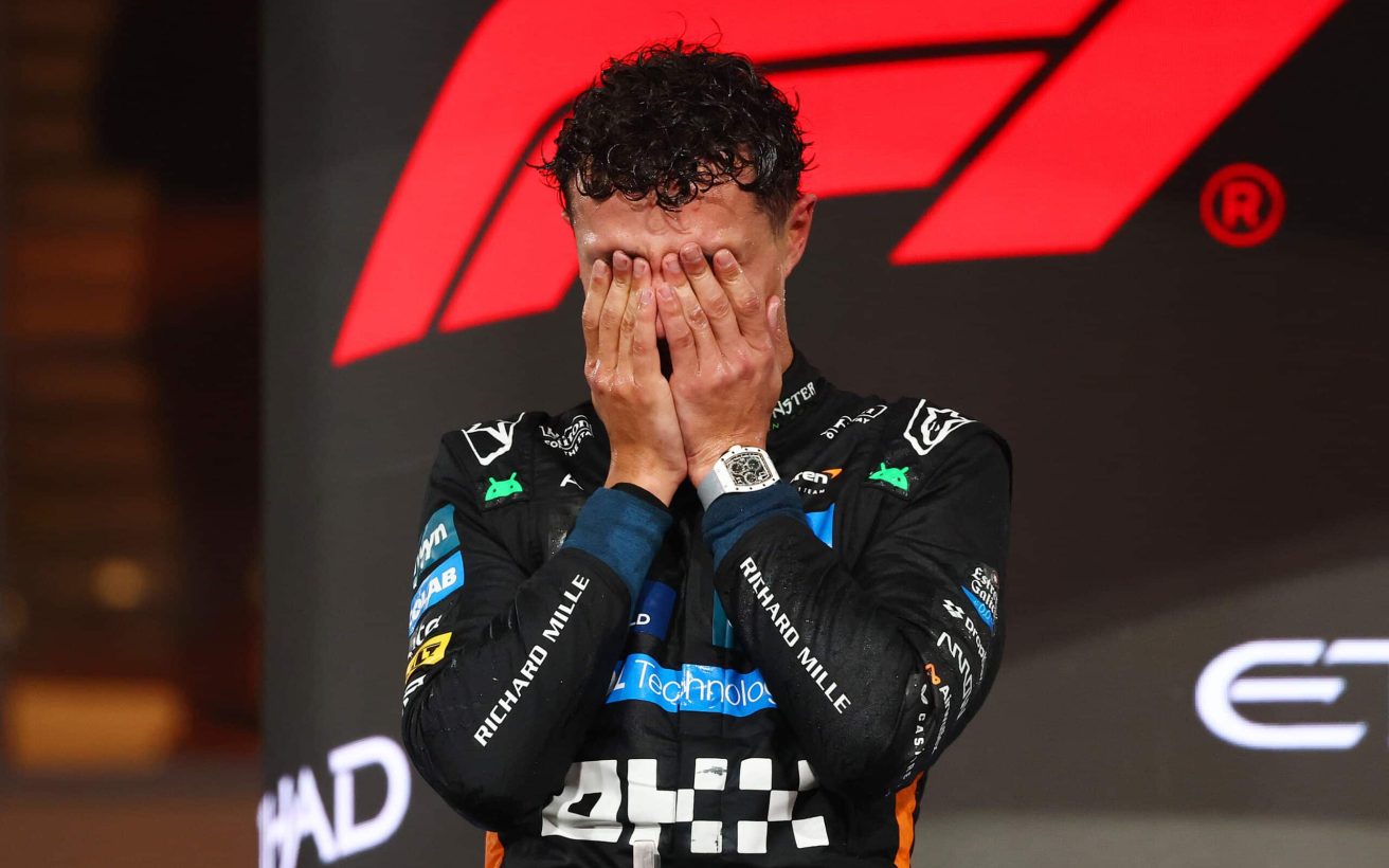 ABU DHABI, UNITED ARAB EMIRATES - DECEMBER 07: 2025 F1 World Drivers Champion and Third placed Lando Norris of Great Britain and McLaren celebrates on the podium during the F1 Grand Prix of Abu Dhabi at Yas Marina Circuit on December 07, 2025 in Abu Dhabi, United Arab Emirates. (Photo by Clive Rose/Getty Images)